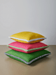 Stack of three soprano cushions with helter skelter piping. Photography by Christopher Horwood